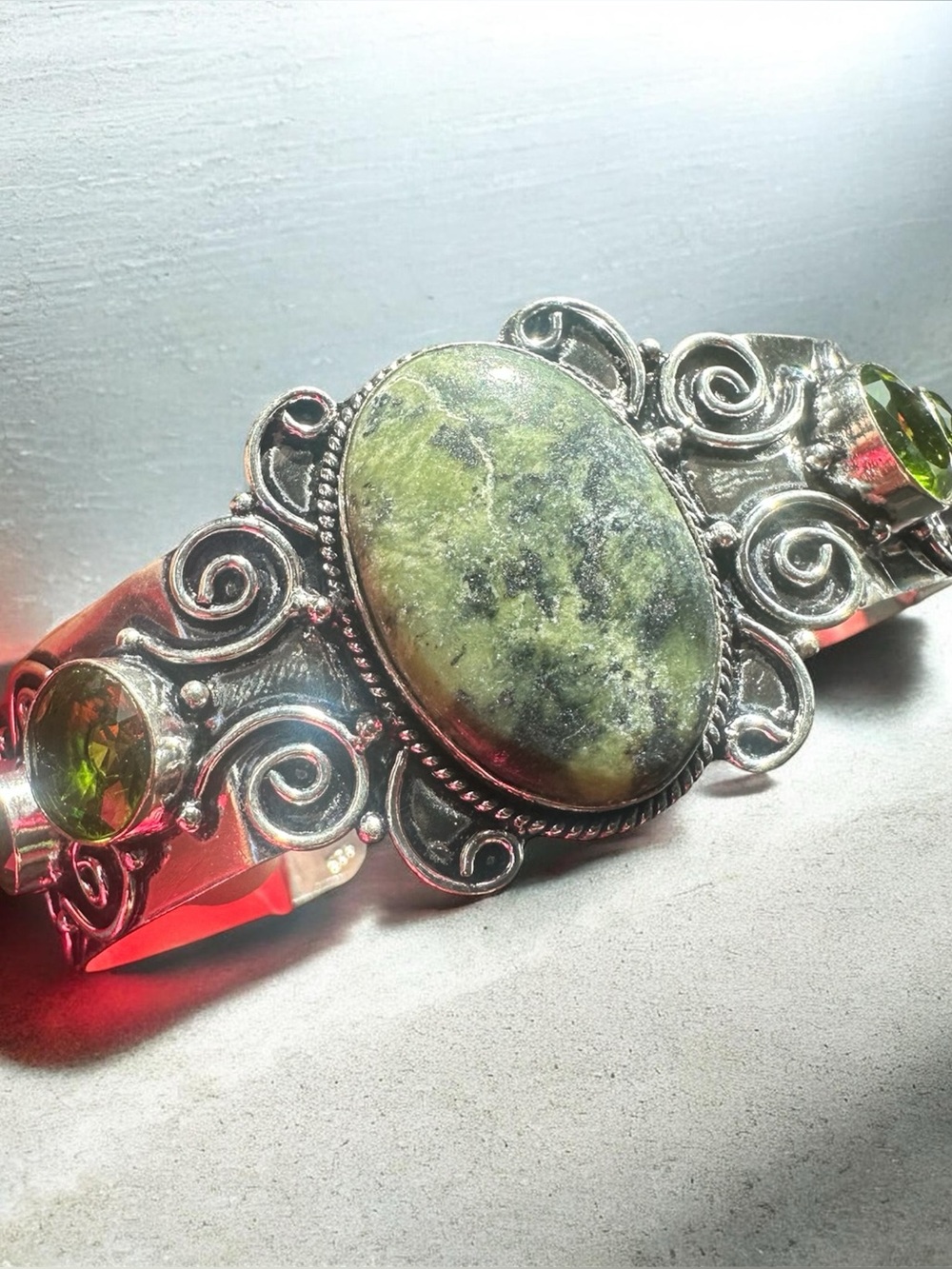 Silver artisan cuff with gemstones